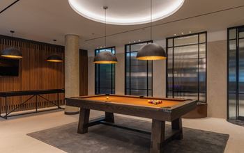 a billiards table in the lobby of an office building